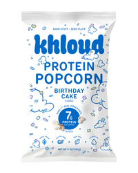 Khloud brand protein popcorn bag in birthday cake flavor, 5 oz, with blue and white packaging displaying nutritional informat